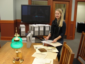 Chapman Center Intern Jessica Hermesch with the collection donated by General Adams